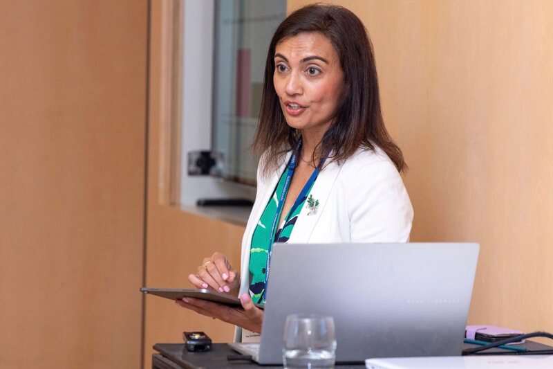 Devi Virdi presenting at a conference